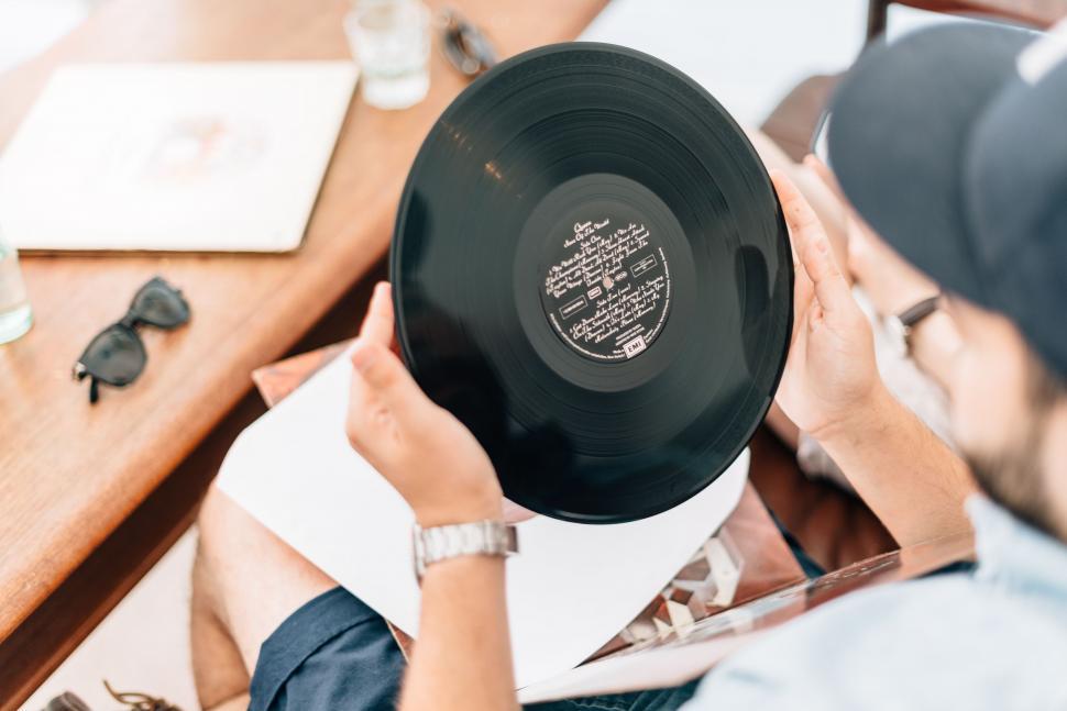 Free Image of Man Holding Record in Hands 