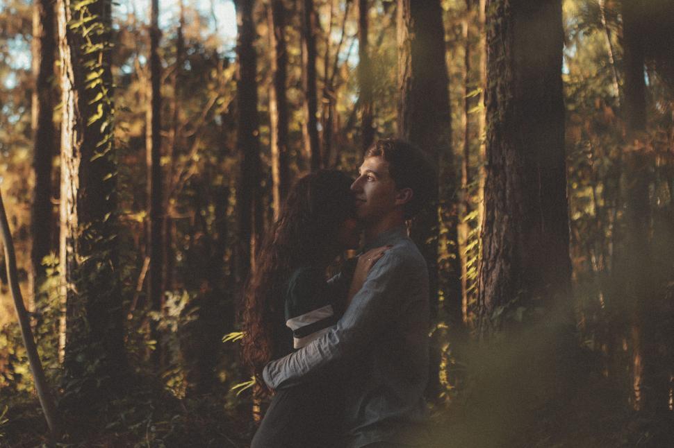 Free Image of Man and Woman Standing in Forest 
