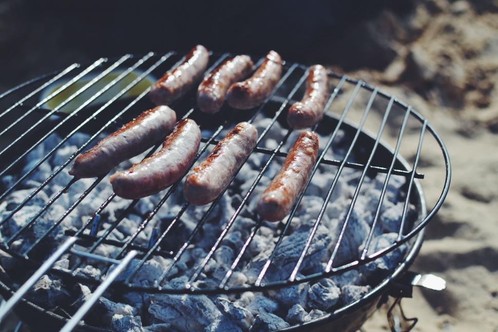 Free Image of Hot Dogs and Sausages Cooking on a Grill 