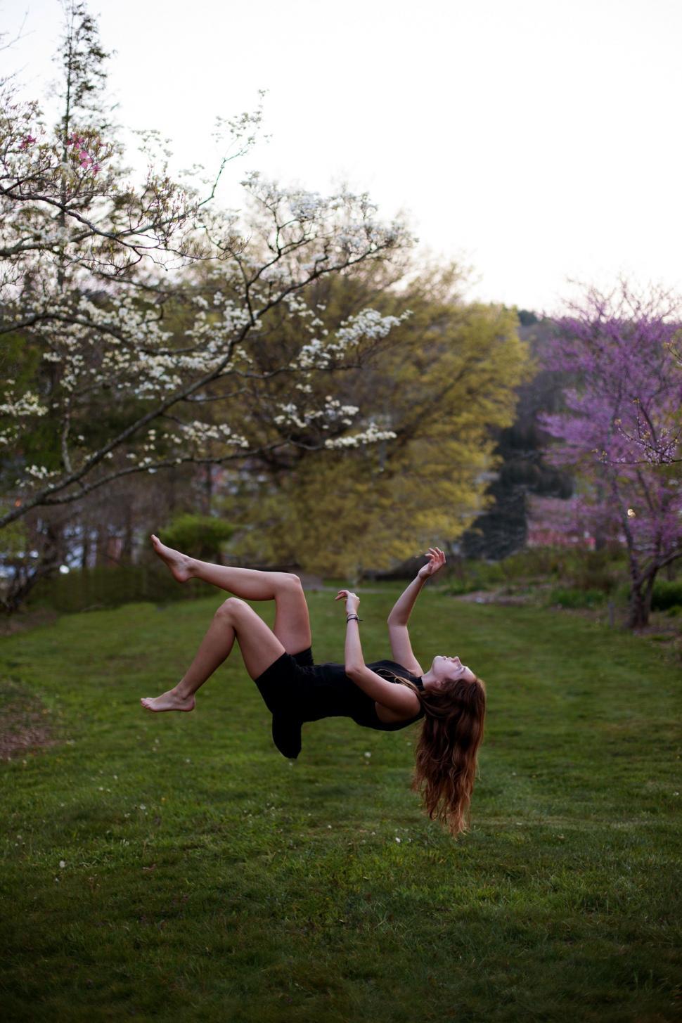 Free Image of Woman Performing Handstand in Grass 