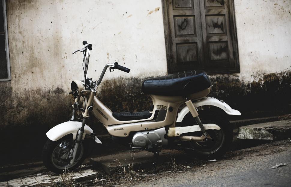 Free Image of Scooter Parked on the Side of a Street 