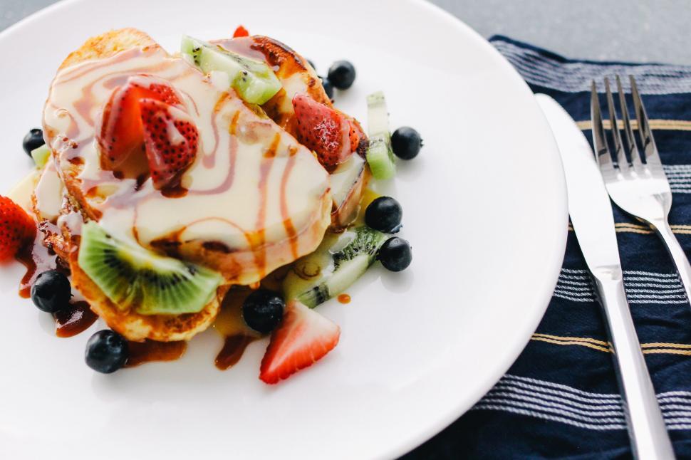 Free Image of White Plate With Fruit-Topped Pancakes 