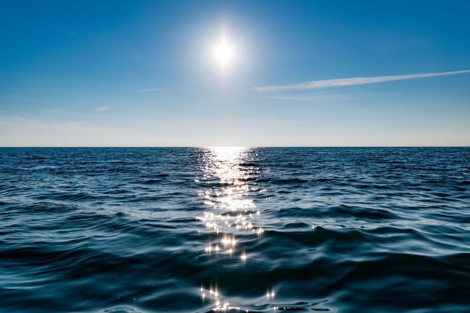 Free Image of Sun Shining Over Ocean Water 