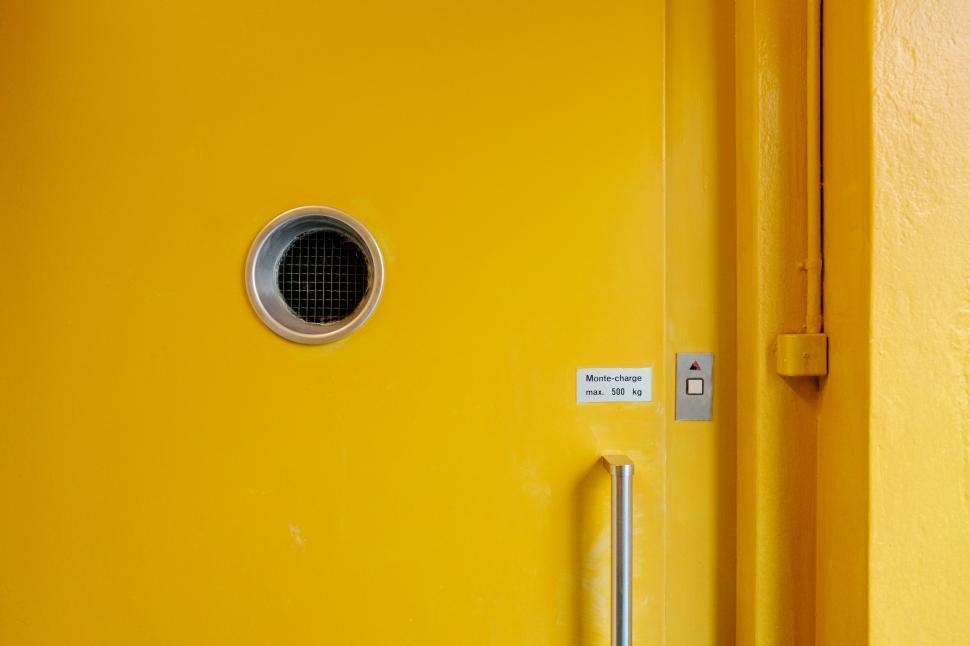 Free Image of Close Up of a Yellow Door With Metal Handle 