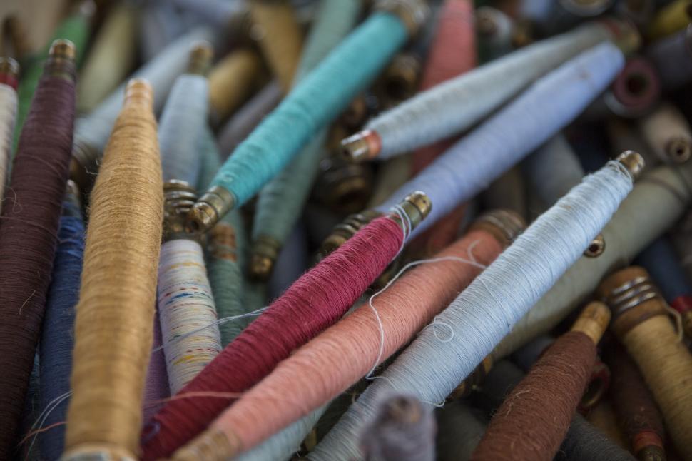 Free Image of Colorful Spools of Thread Close Up 