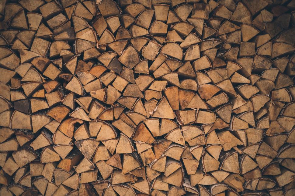 Free Image of A Large Pile of Wood on a Wooden Floor 