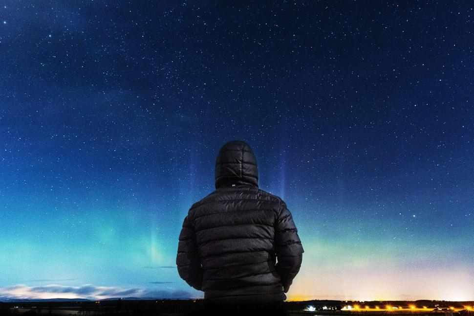 Free Image of Person Standing in Front of Night Sky 