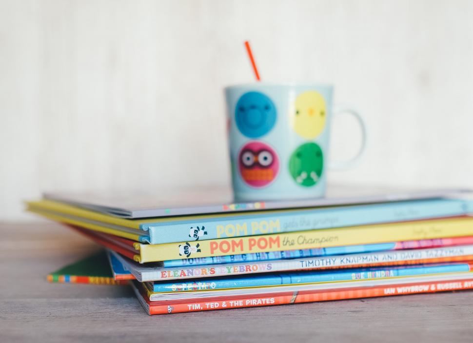 Free Image of Stack of Childrens Books and Coffee Cup 
