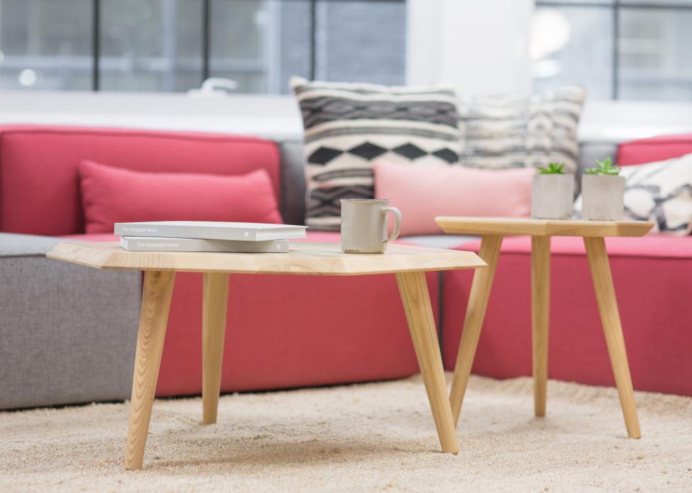 Free Image of A Stylish Living Room With Red Couch and Coffee Table 