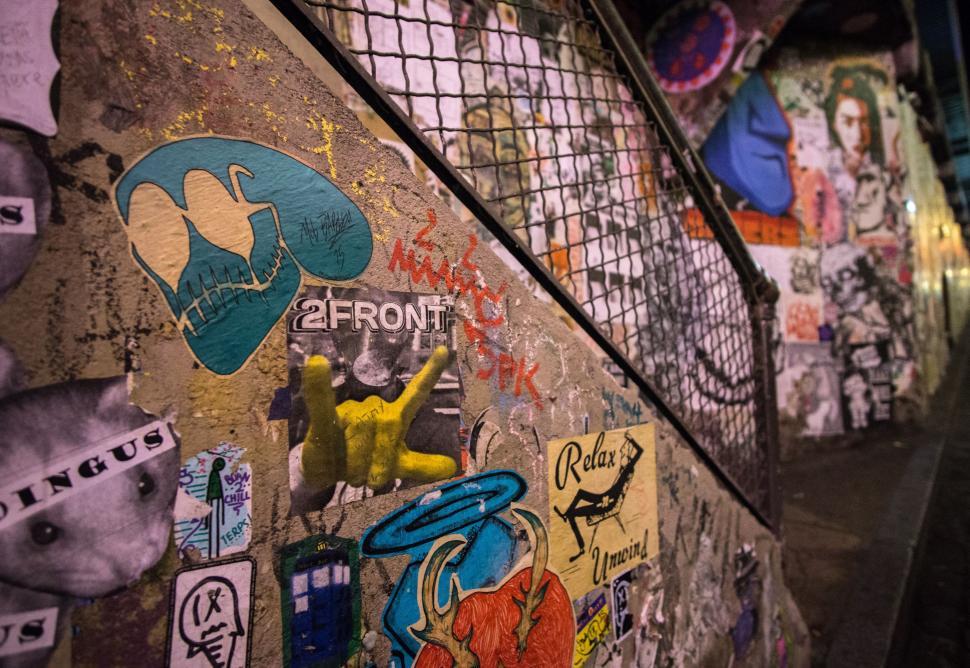 Free Image of Wall Covered in Graffiti and Stickers 