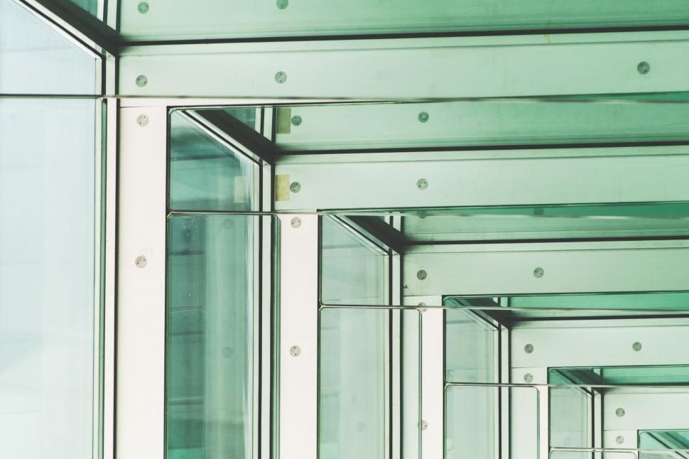 Free Image of A Row of Glass Windows in a Modern Office Building 
