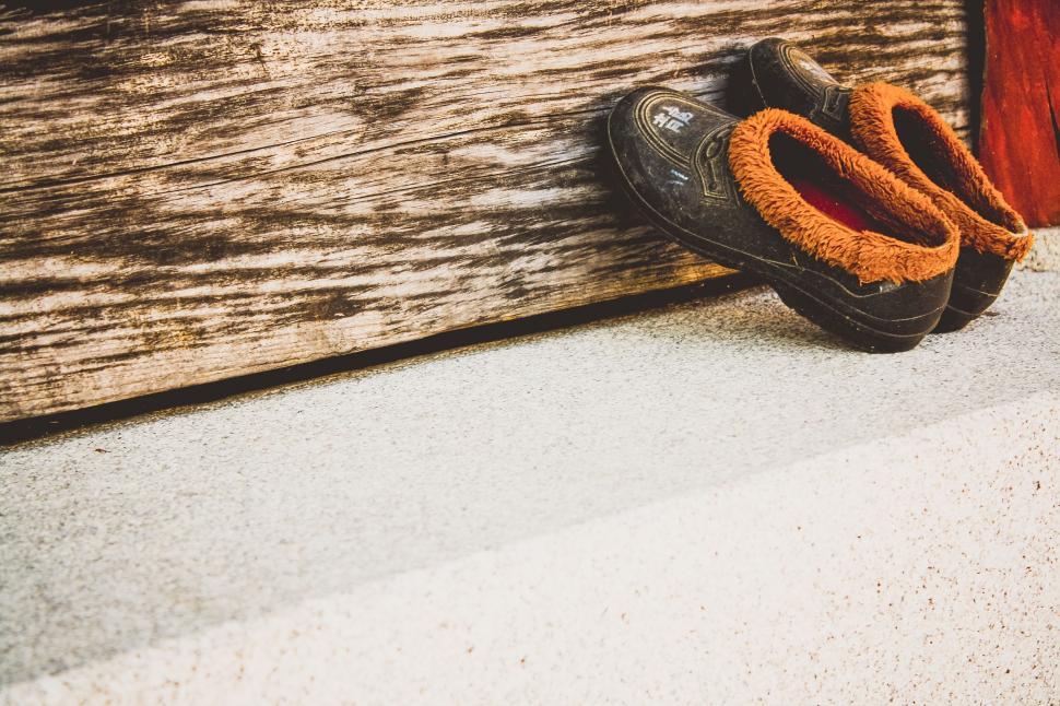 Free Image of Pair of Shoes Resting on Ledge 