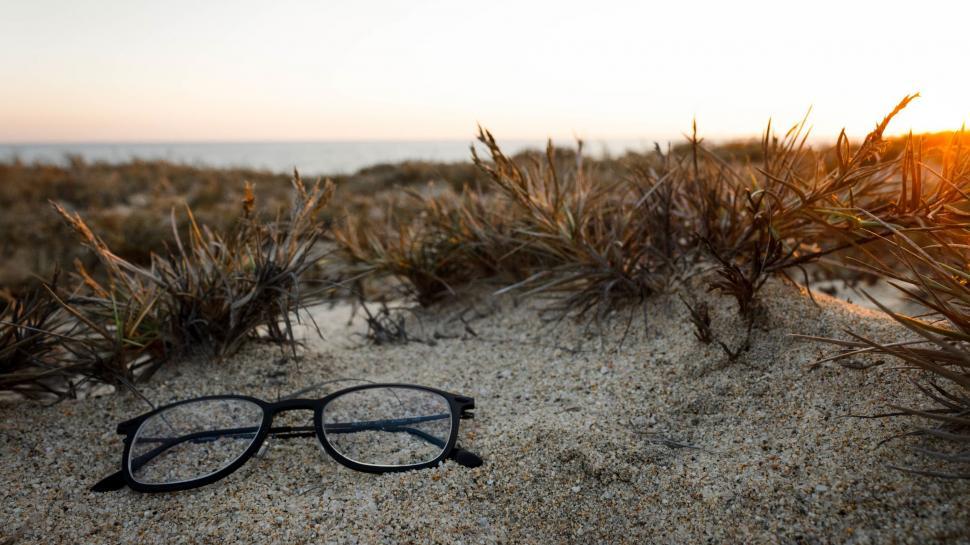 Free Image of Glasses on Sandy Beach 