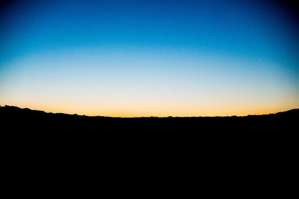 Free Image of Sunset Over Hill With Blue Sky 