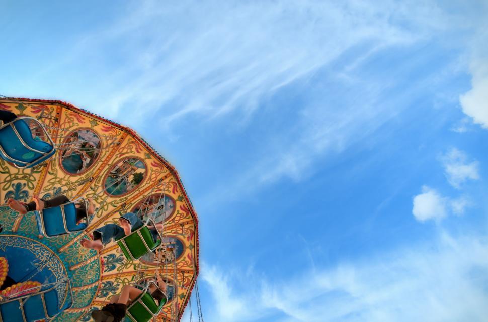Free Image of Close Up of Carnival Ride Against Blue Sky 