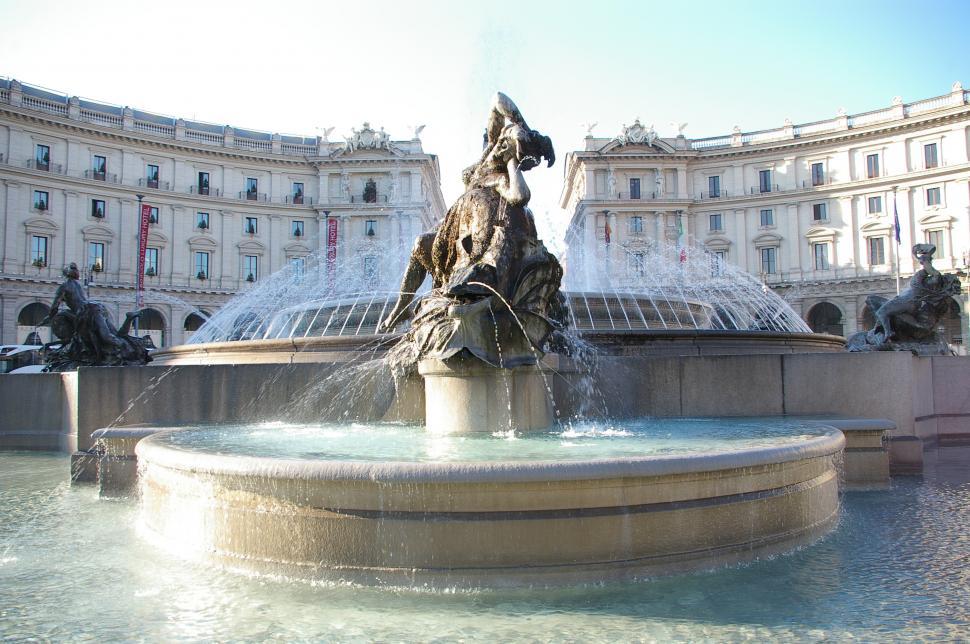 Free Image of Fountain With Statue in Front of Building 