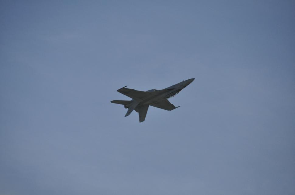 Free Image of Fighter Jet Flying Through Blue Sky 