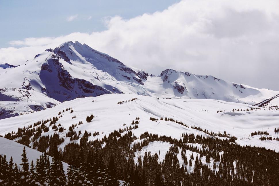 Free Image of Snow-Covered Mountain Under Sky Background 
