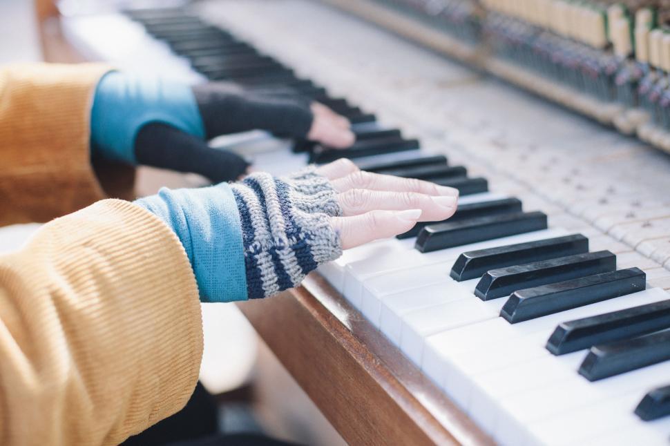 Free Image of Person Wearing Gloves Playing Piano 