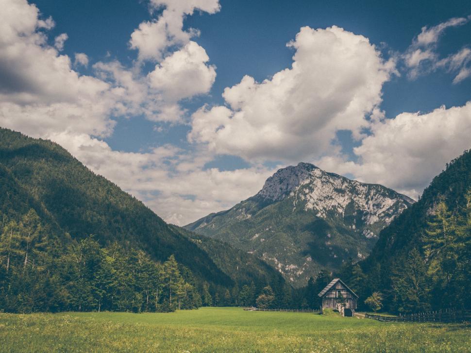 Free Image of House Surrounded by Field and Mountains 