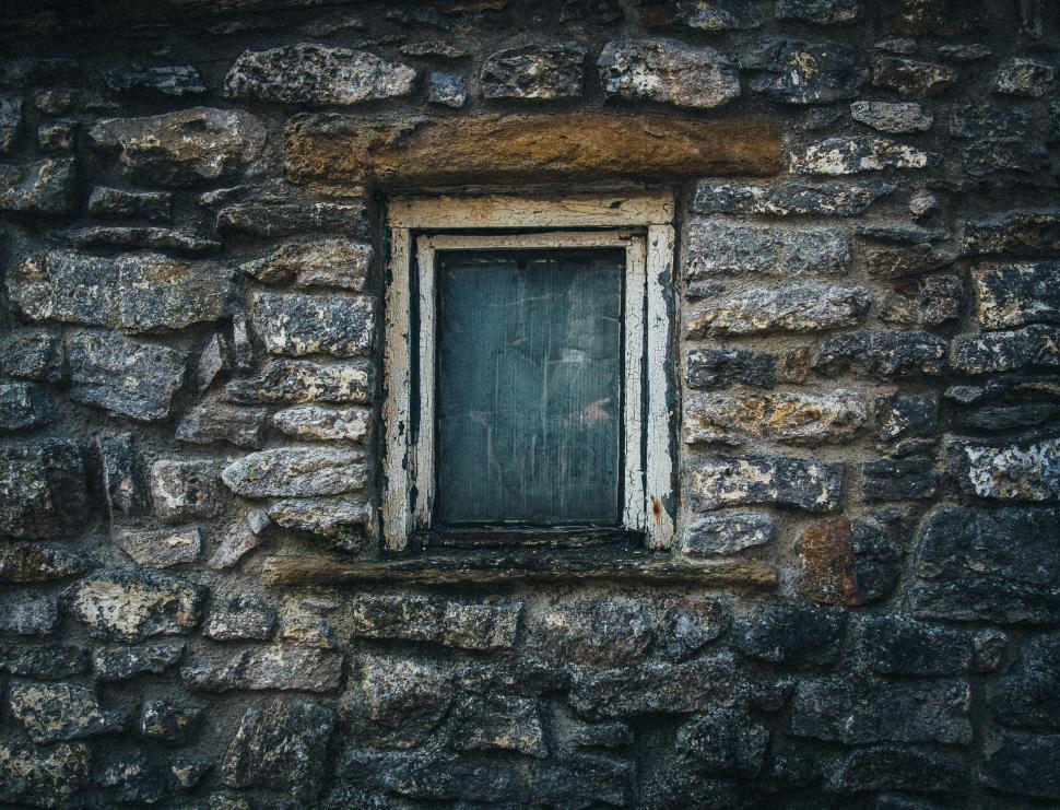 Free Image of A Window in a Stone Wall With a Wooden Frame 