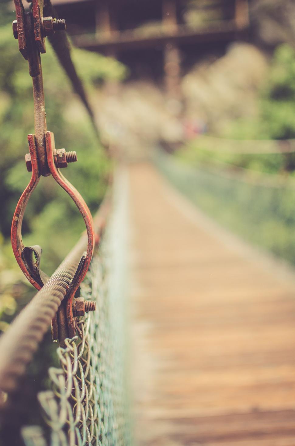 Free Image of Chain Link Fence With Wooden Bridge 
