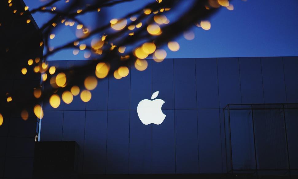 Free Image of Apple Logo Illuminated on Building Facade at Night 