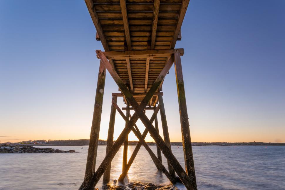 Free Image of Wooden Structure Over Body of Water 