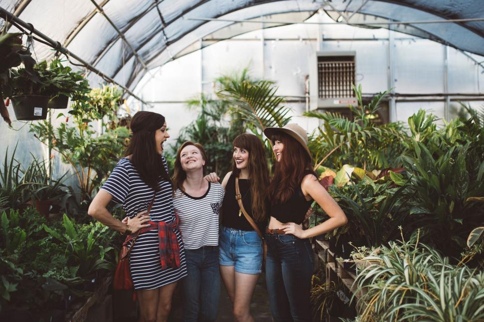 Free Image of Group of Women Standing in Greenhouse 