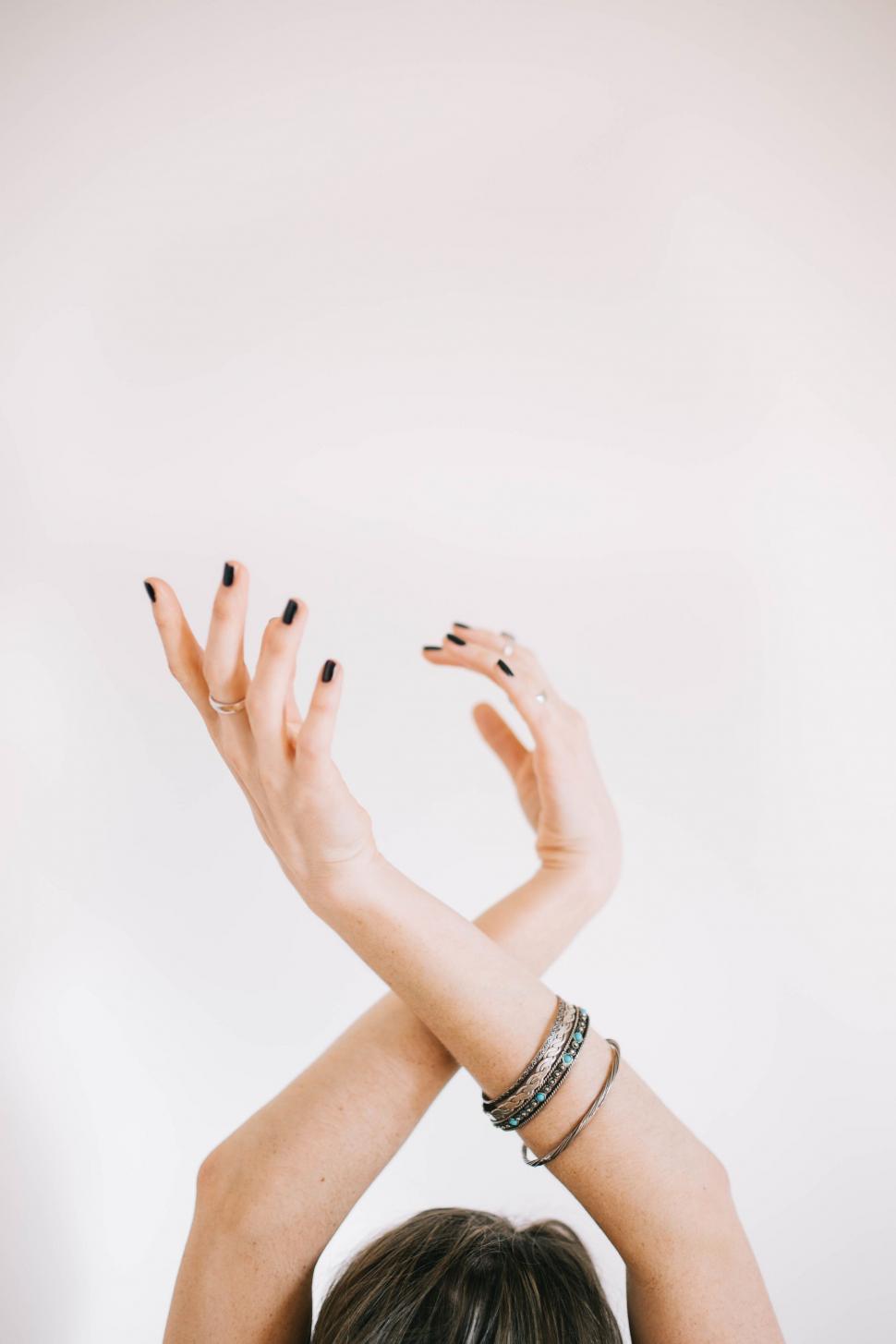 Free Image of Woman Raising Her Hands in the Air 