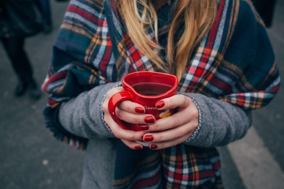 Free Image of Woman Holding Red Cup 
