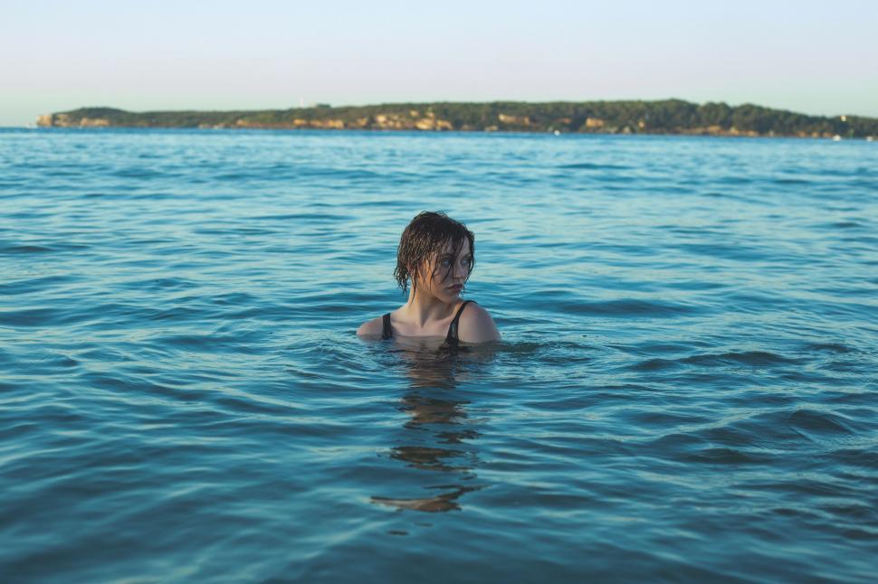 Free Image of Woman Swimming in a Lake 
