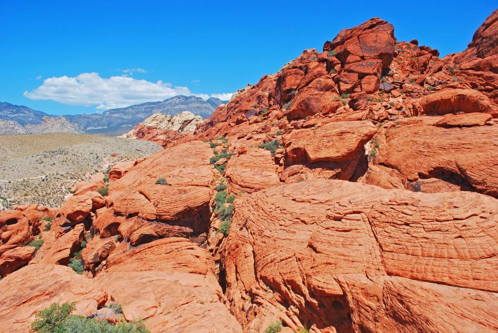 Free Image of Rocky Landscape With Mountain Range in Background 