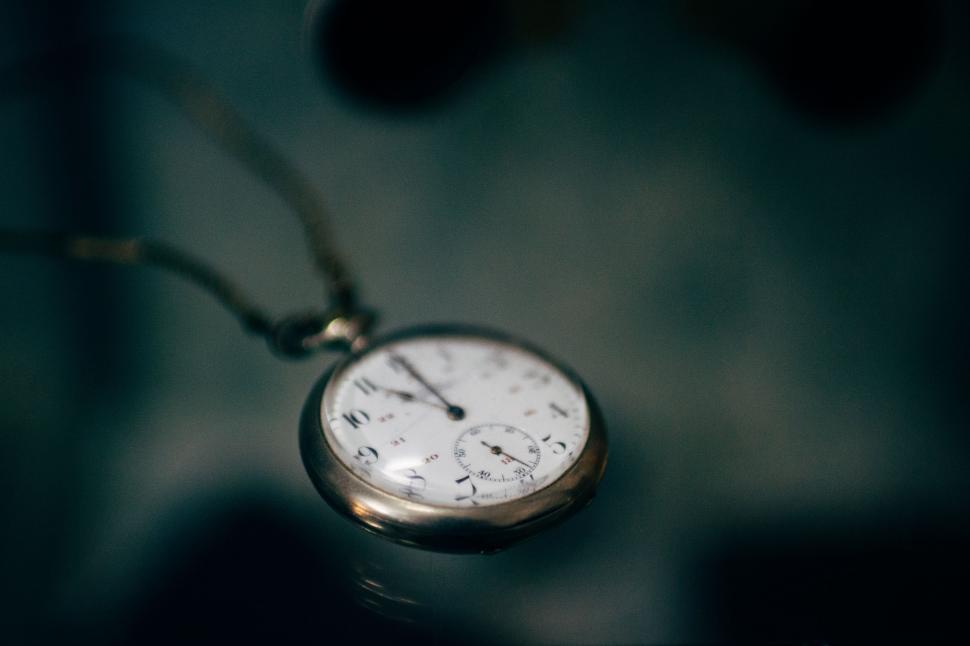 Free Image of Close Up of a Pocket Watch on a Chain 
