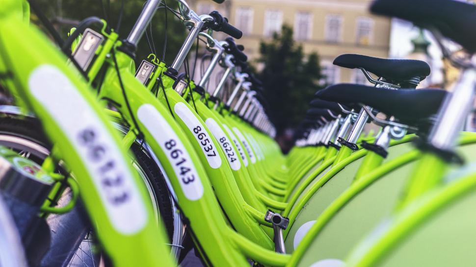 Free Image of Row of Green Bicycles Parked Next to Each Other 