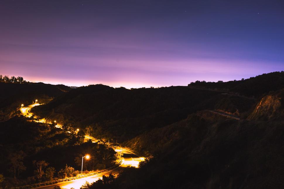 Free Image of Night Time View of a Mountain With Lights On 