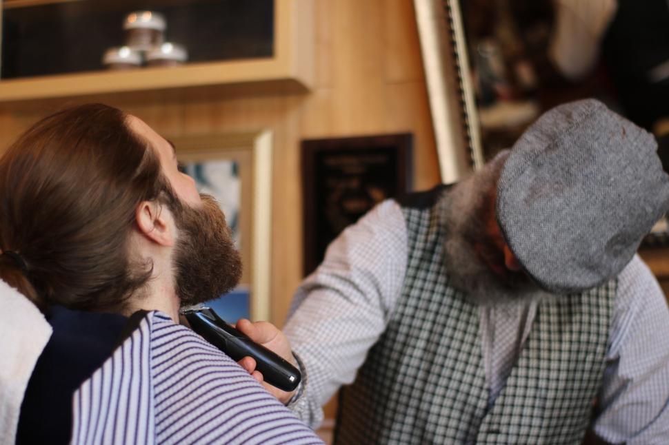 Free Image of Man Getting Hair Cut by Another Man 