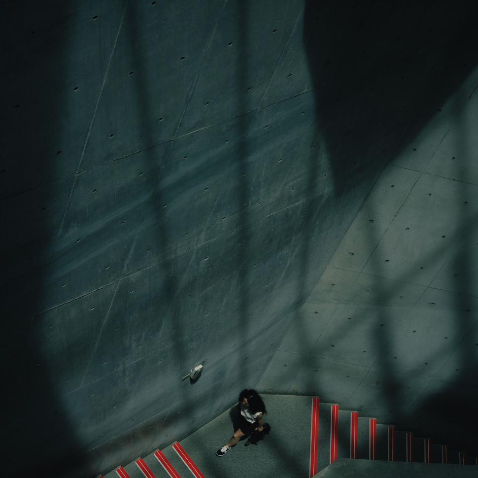 Free Image of Person Walking Down a Set of Stairs 