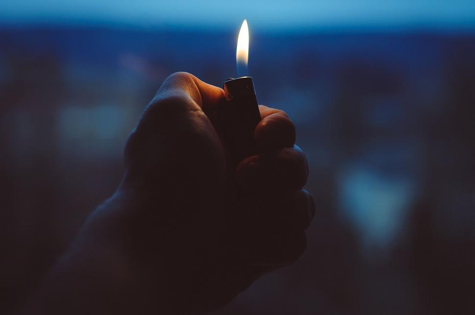 Free Image of Person Holding Lit Match 