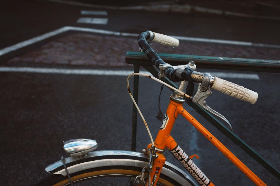 Free Image of Close Up of a Parked Bike in a Parking Lot 