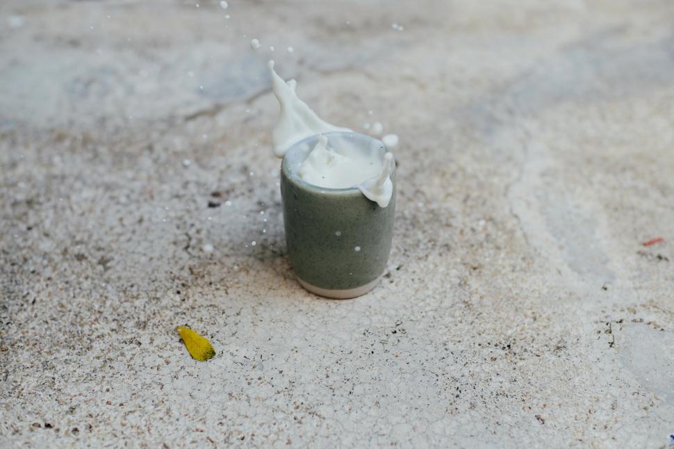 Free Image of Glass of Milk on Sandy Beach 