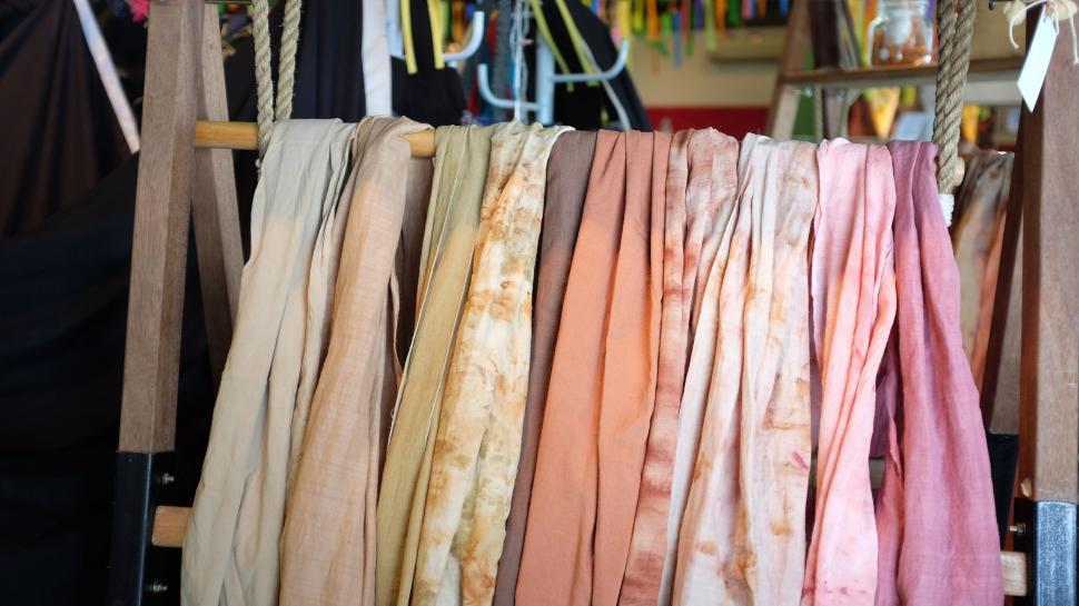 Free Image of Collection of Scarves Hanging From a Rope 
