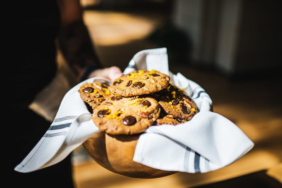 Free Image of Wooden Bowl Filled With Cookies on Table 