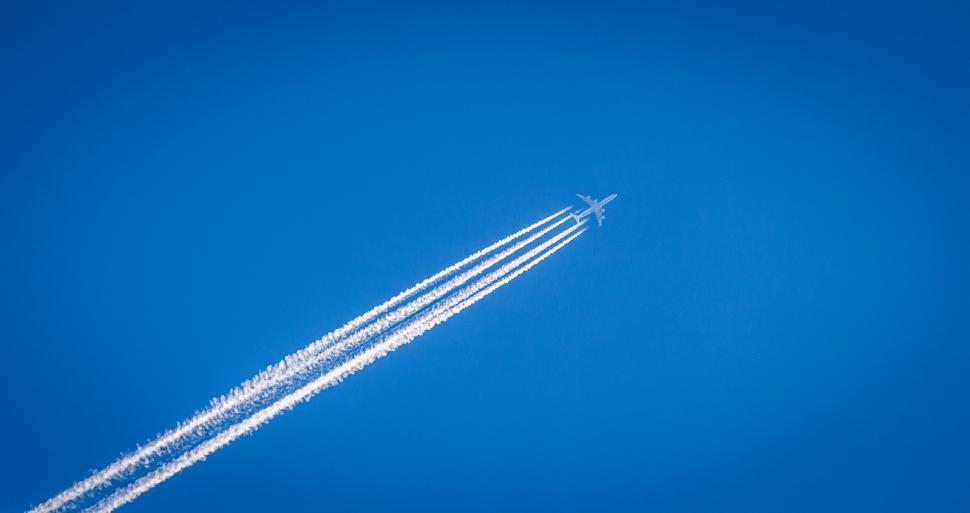Free Image of Airplane Flying in Blue Sky 