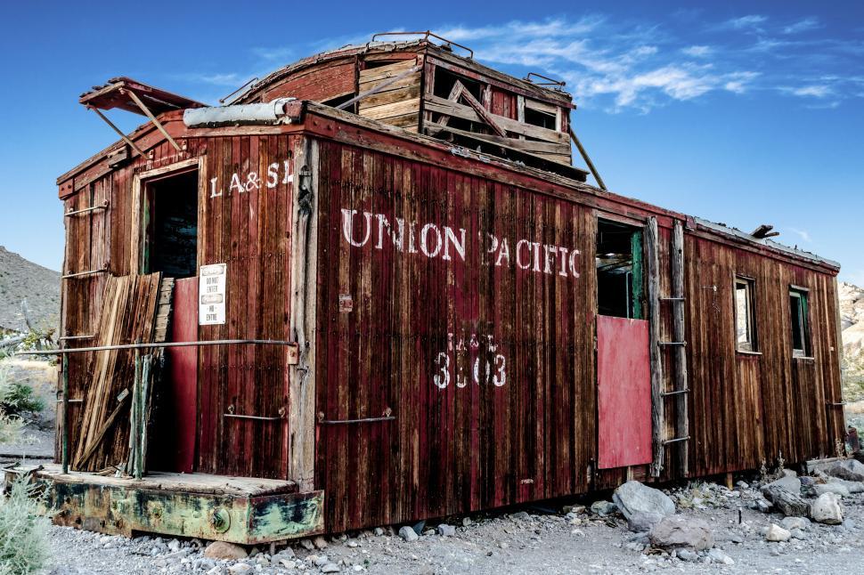 Free Image of Abandoned Train Caboose in Desert 