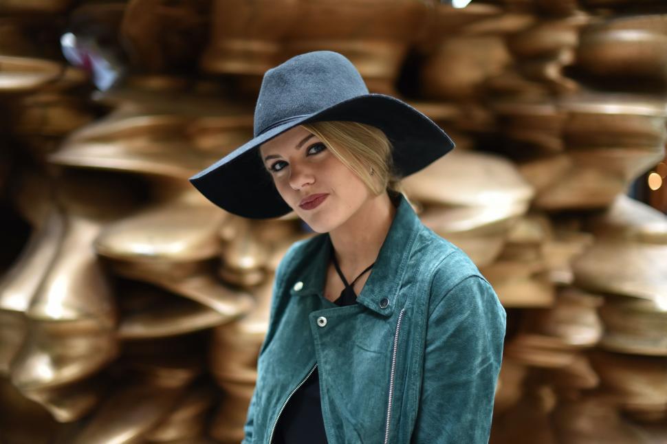 Free Image of Woman Wearing Blue Hat and Green Jacket 