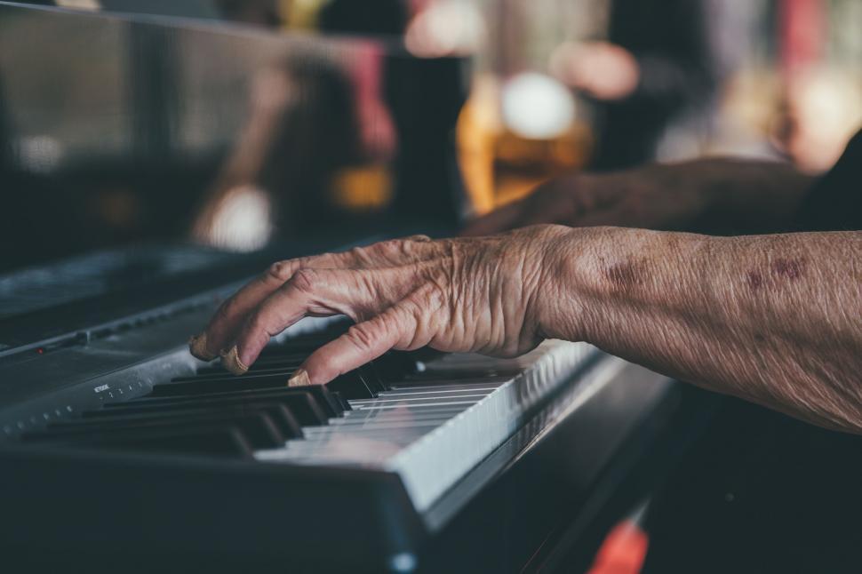 Free Image of Persons Hand Playing Piano Keyboard 