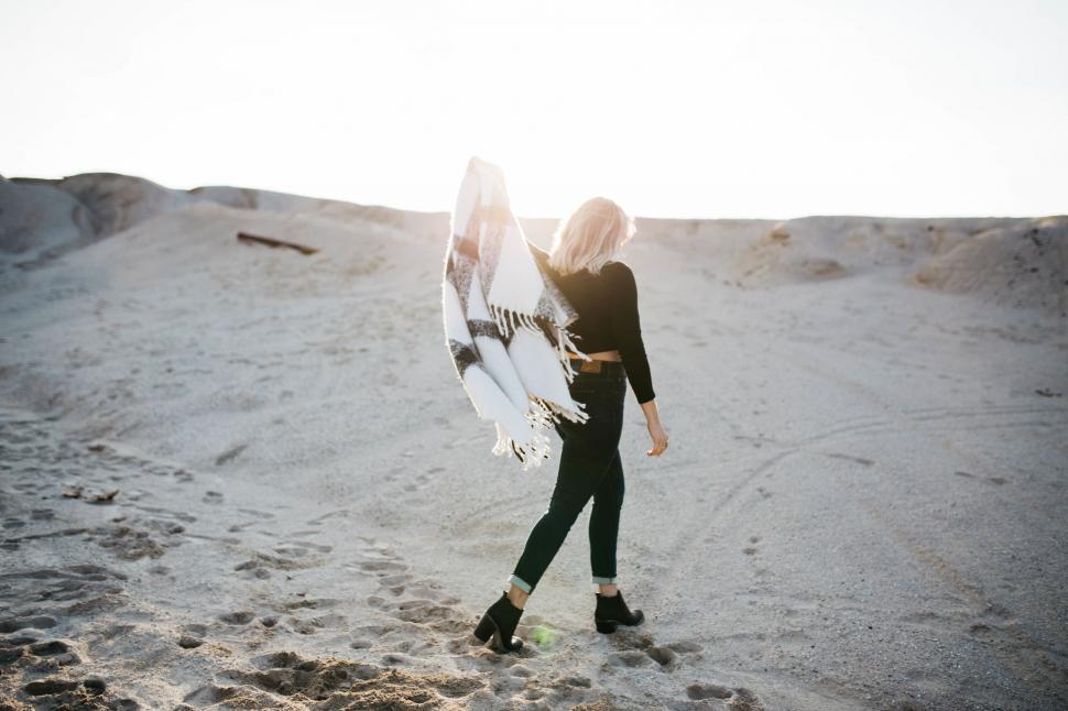 Free Image of Woman Holding Surfboard on Sandy Beach 