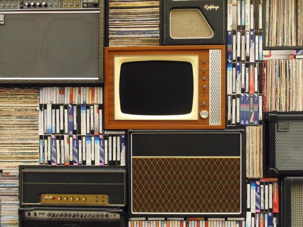 Free Image of Wall of Old Televisions and Amps 