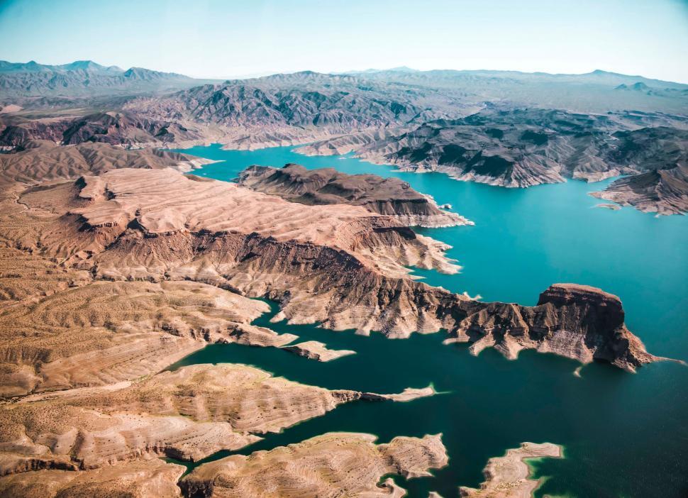 Free Image of Aerial View of a Lake Surrounded by Mountains 